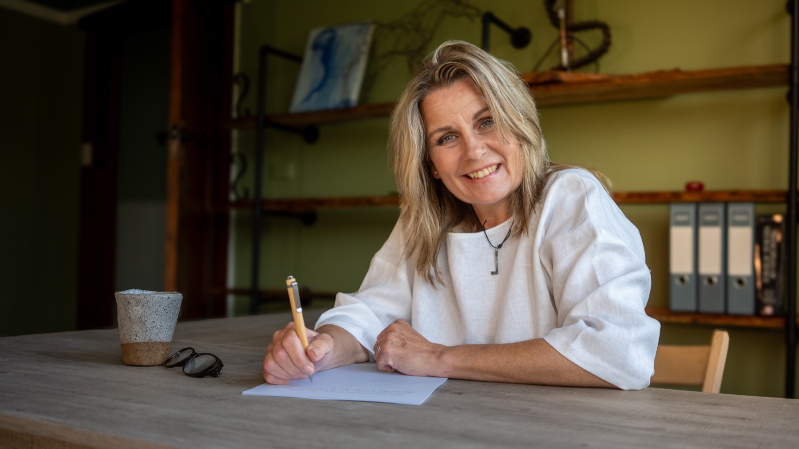 Annica Larsdotter at her desk, preparing for the day